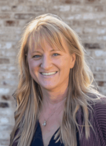 me with brick background e1749318775399